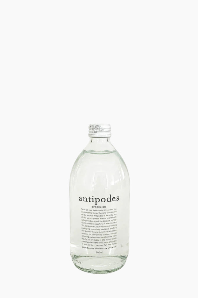 A transparent bottle labeled 'ANTIPODES' containing sparkling water, set against a white background.