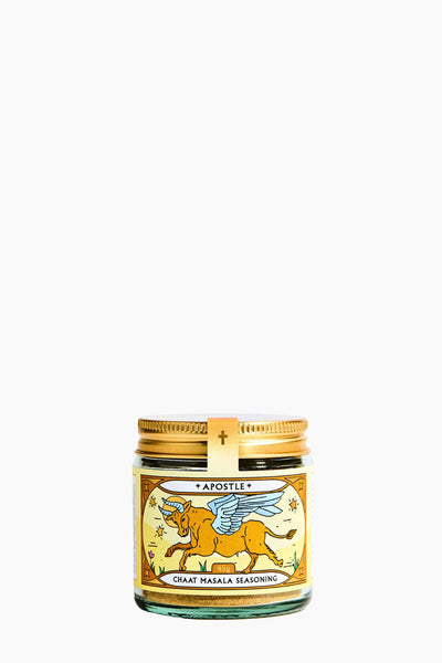 Jar of Chait Masala Seasoning with a gold lid on a white background