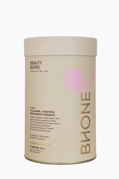 A cylindrical canister of Bione Beauty Blend Skin Broth Powder on a clean white background. The canister is beige with a light pink abstract circle and diagonal stripe graphic, and the brand name 'BIONE' is printed vertically in gold on the right side.