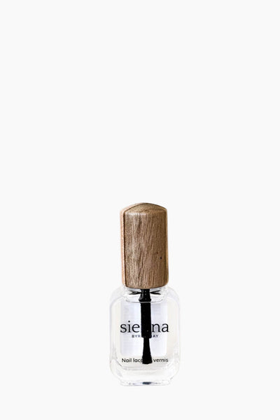 Small glass bottle with wooden cap on a white background