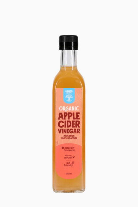 Bottle of organic apple cider vinegar on a white background