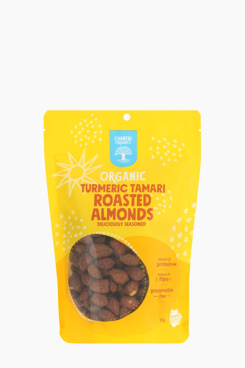 Yellow package of Organic Turmeric Tamari Roasted Almonds on a white background