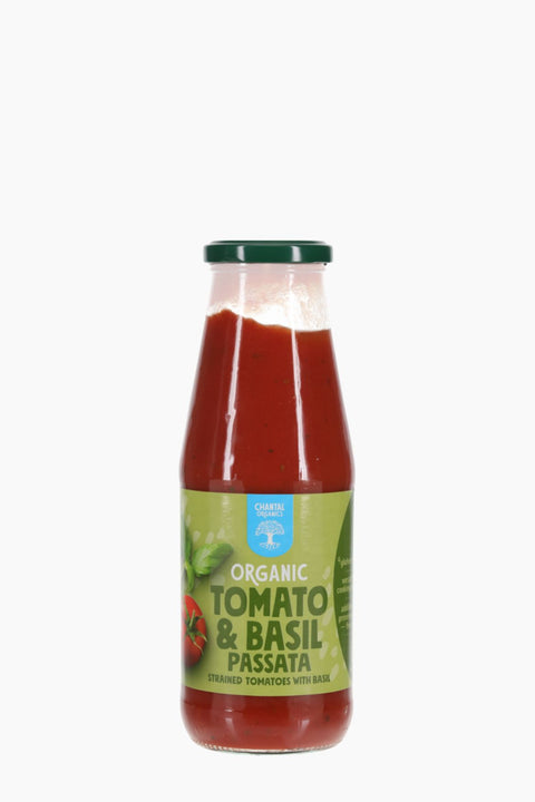 Bottle of organic tomato and basil passata on a white background