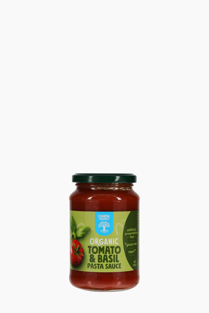 Jar of organic tomato and basil pasta sauce on a white background