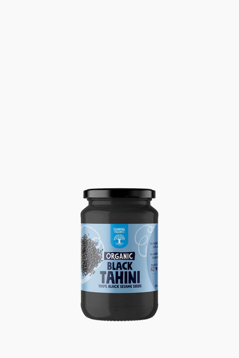 Jar of Organic Black Tahini on a white background