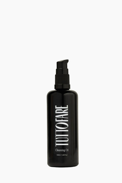 Black bottle of Tuttofare Cleansing Oil on a white background