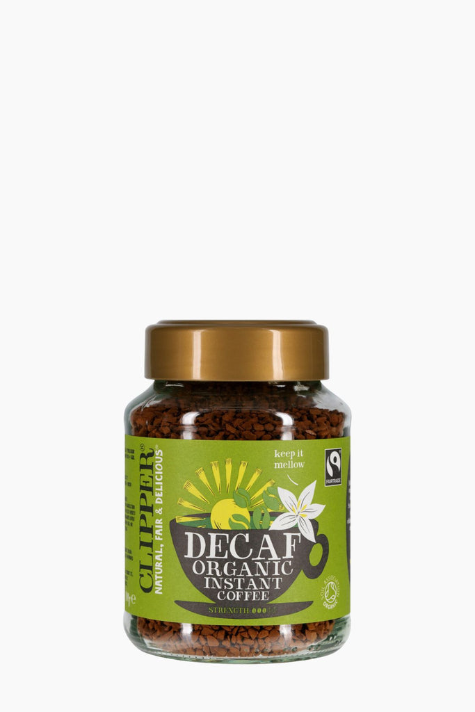 Jar of decaf organic instant coffee with a green label on a white background