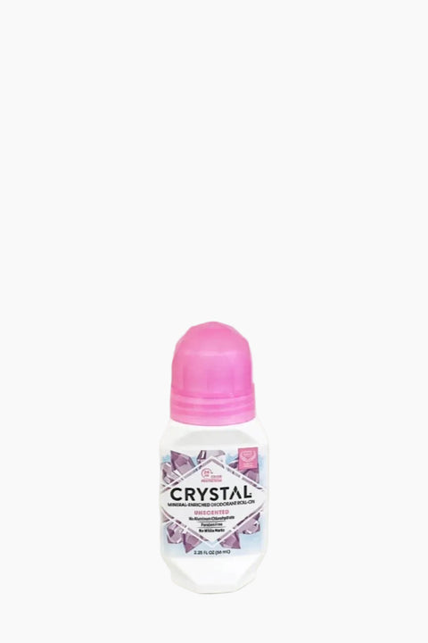 A roll-on deodorant with a pink cap labeled 'CRYSTAL'.