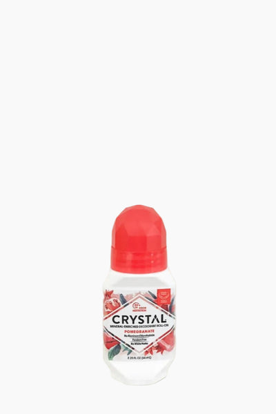 A roll-on deodorant with a white and red container, labeled 'CRYSTAL' with a pomegranate graphic.