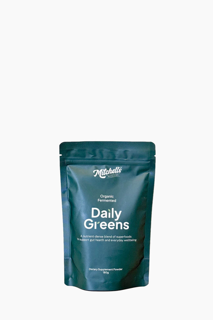 Blue package of Mitchell's Daily Greens on a white background