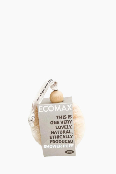 A beige loofah sponge attached to a cardboard packaging with 'Ecomax' branding and text stating 'This is a loofah very lovely, naturally produced, shower puff.'.