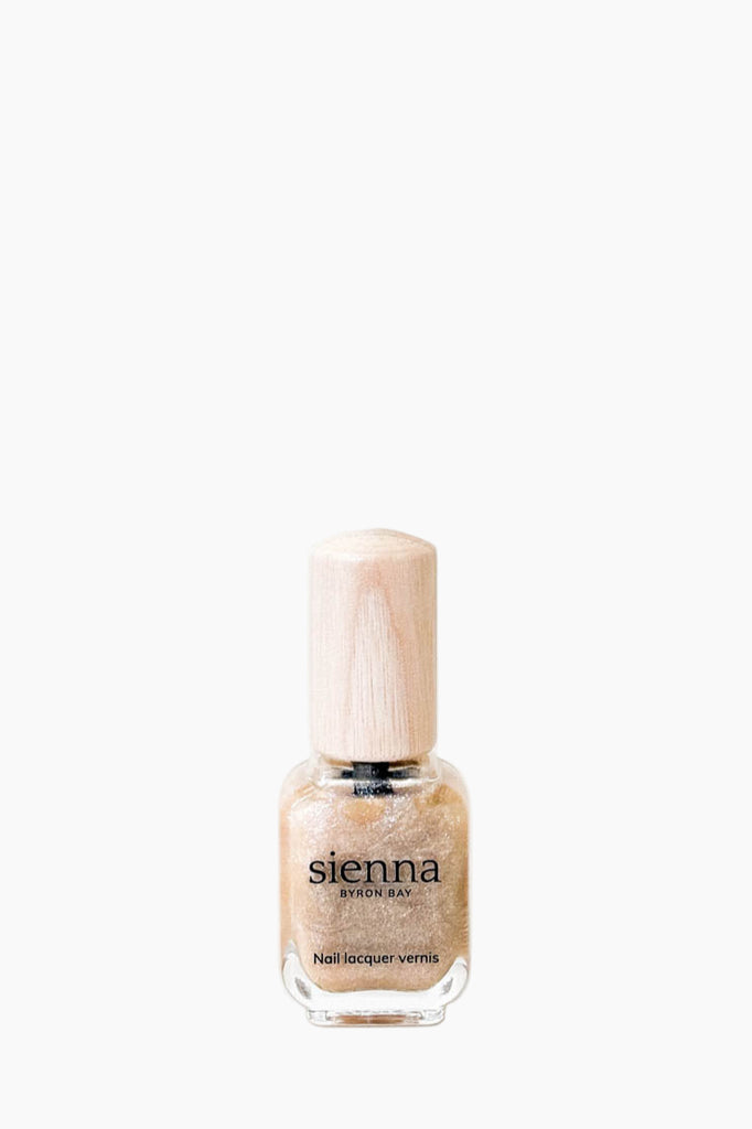 Nail polish bottle with 'sienna' label on a white background