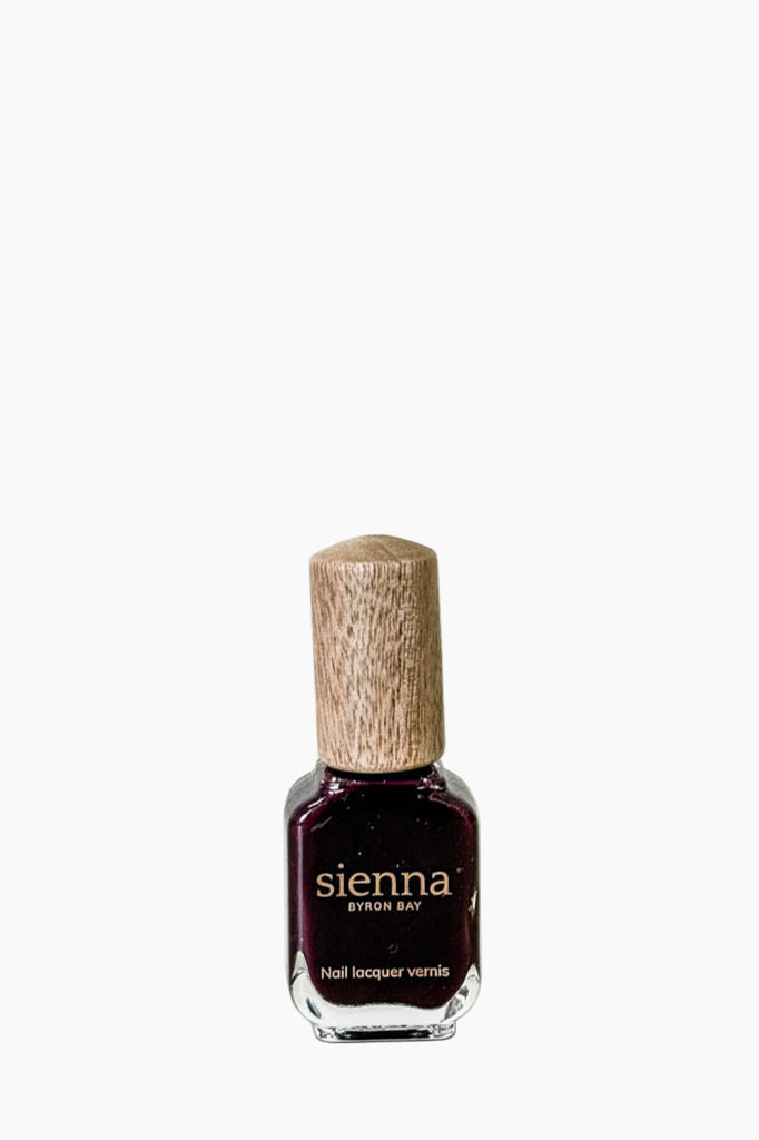 Nail polish bottle with cork cap on a white background