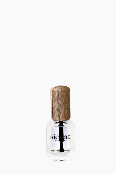 Small glass bottle with wooden cap on a white background