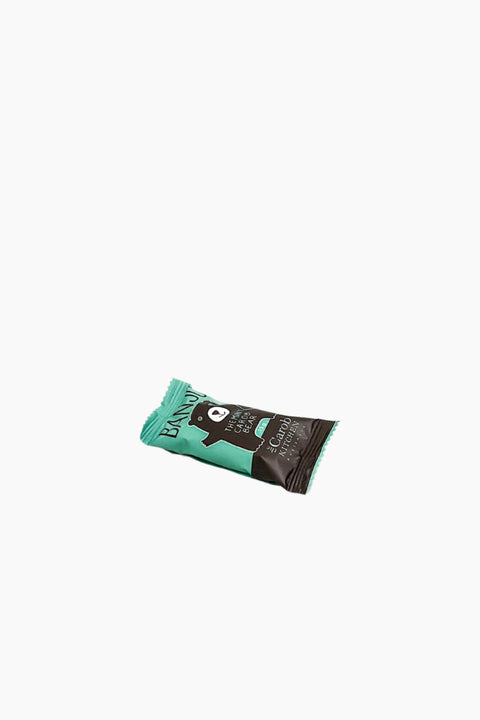 A wrapped chocolate bar with a bear design on the packaging, labeled as 'The Carob Kitchen Banjo The Carob Bear Mint'.