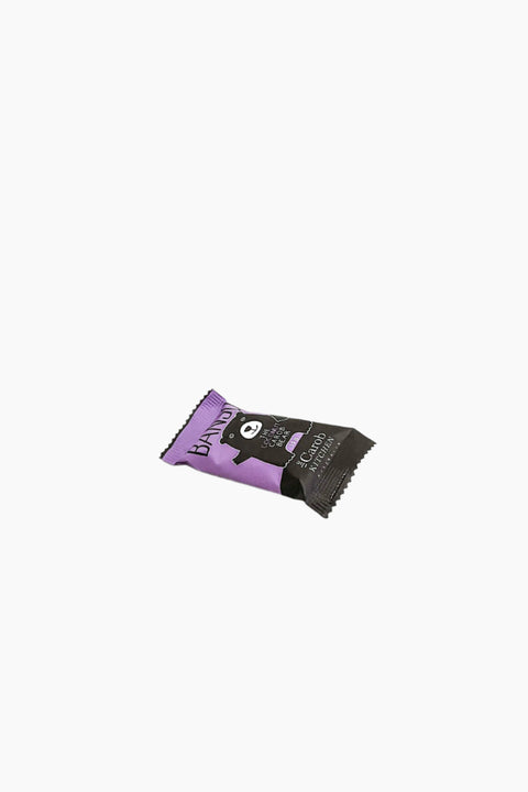 A wrapped chocolate bar with a purple and black wrapper, labeled 'Banjo Bear', featuring an image of a bear and text indicating the product is organic.