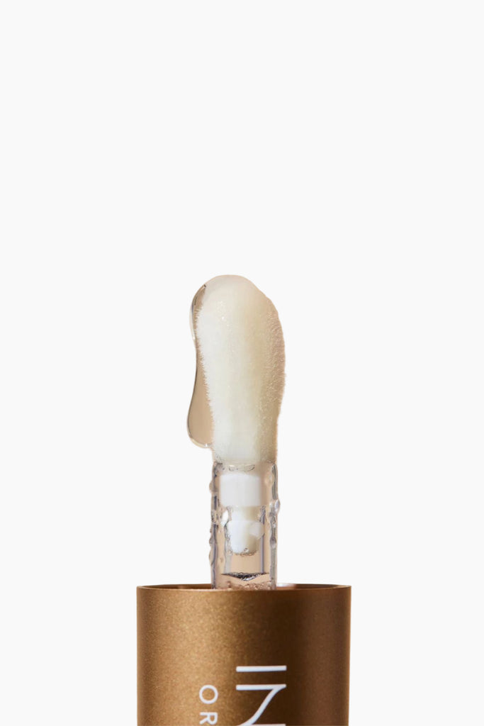 Cosmetic applicator with white foam on a beige background