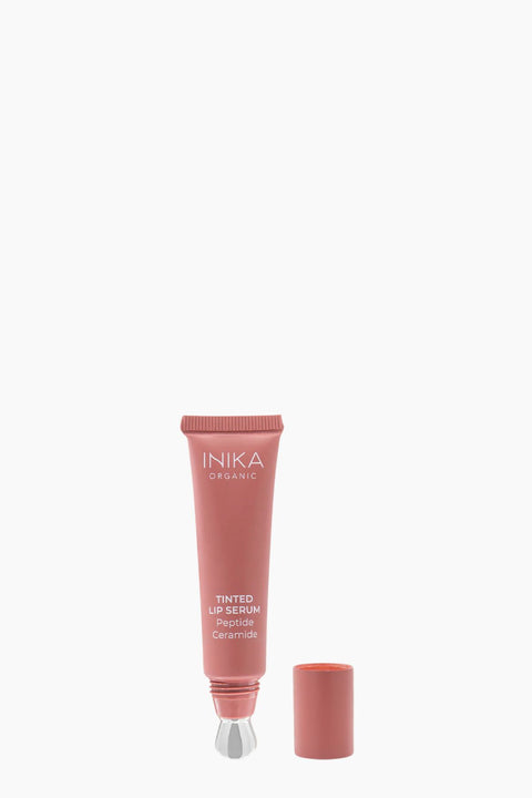 INIKA tinited Peony lip serum tube on a white background