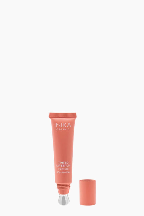 INIKA tinted blush lip serum on a white background