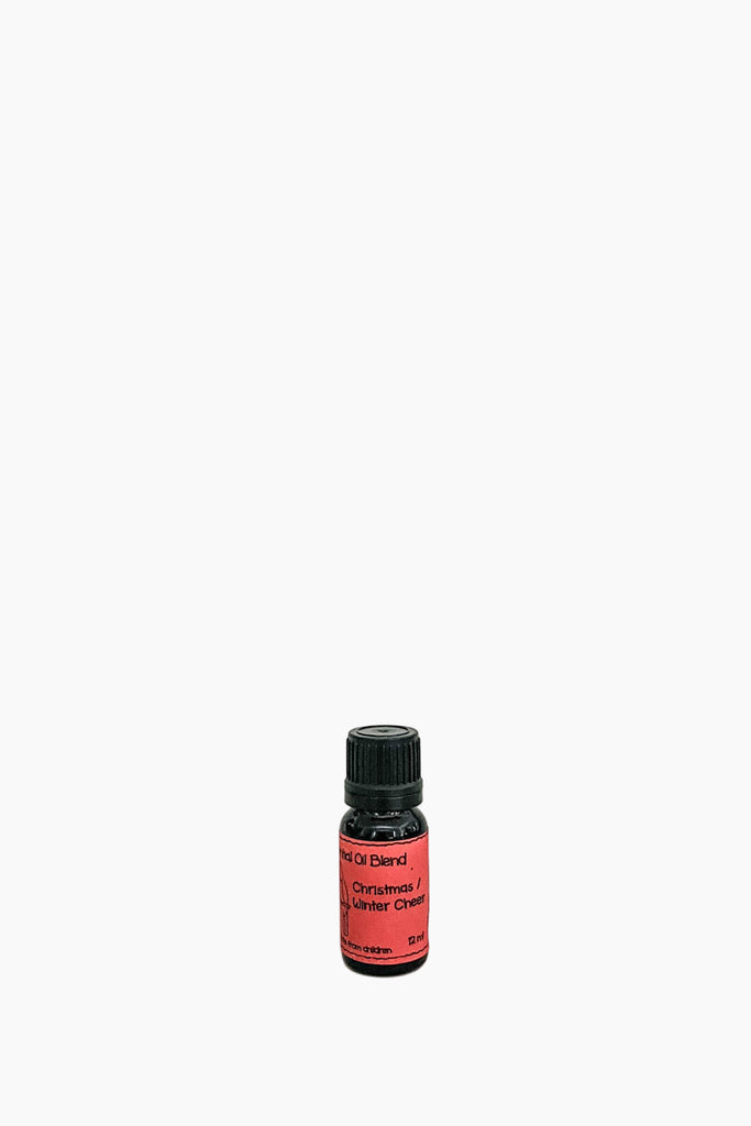 A bottle of Kereru Christmas Blend essential oil diffuser on a plain background.