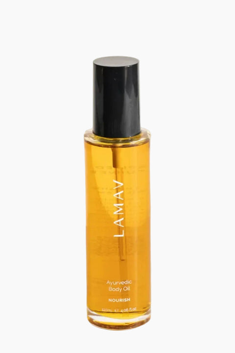 Bottle of LAMAV body oil on a white background