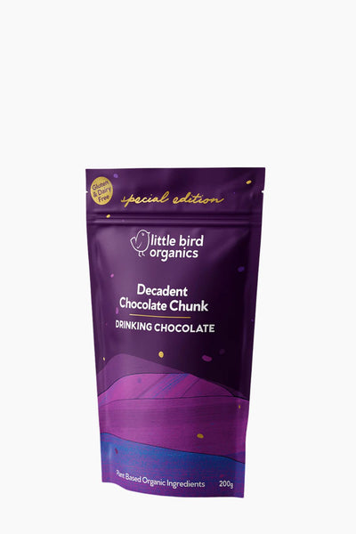 Purple package of Little Bird Organics Decadent Chocolate Chunk Drinking Chocolate on a white background