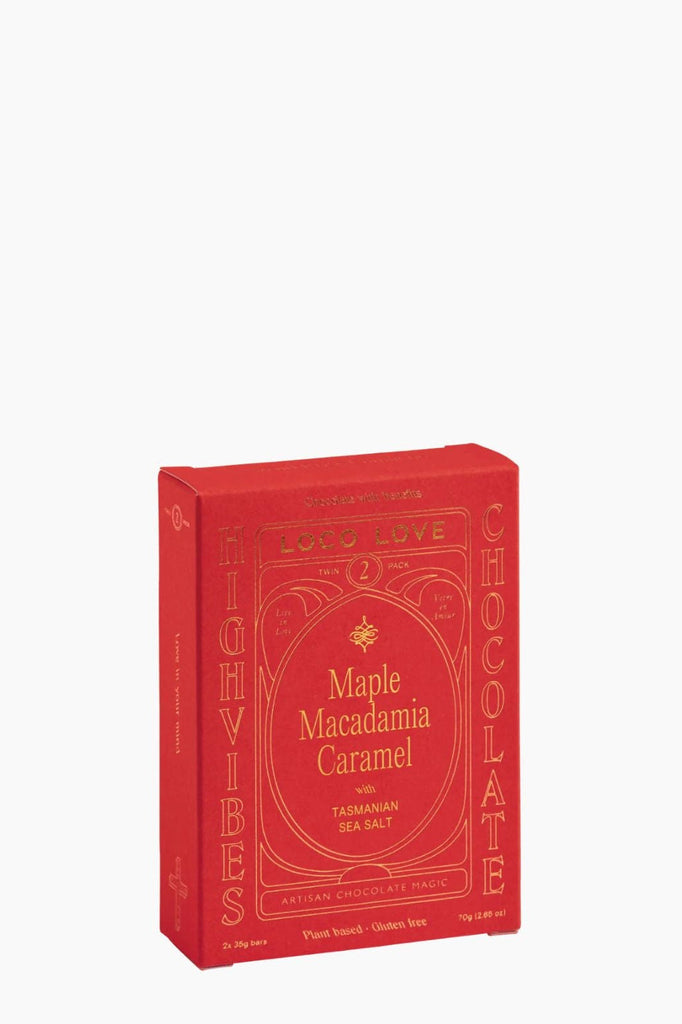 Red book with decorative text on a white background