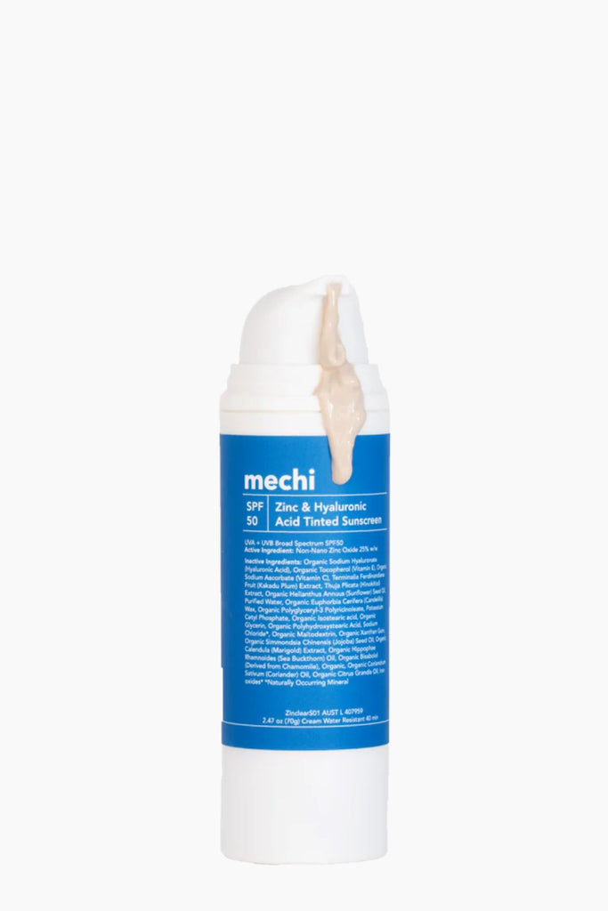 Tube of 'mechi' sunscreen with blue label on a white background