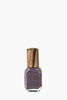 Nail polish bottle with wooden cap on a white background
