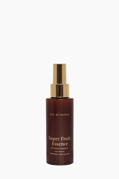 Bottle of 'Super Fruit Essence' with gold cap on a white background