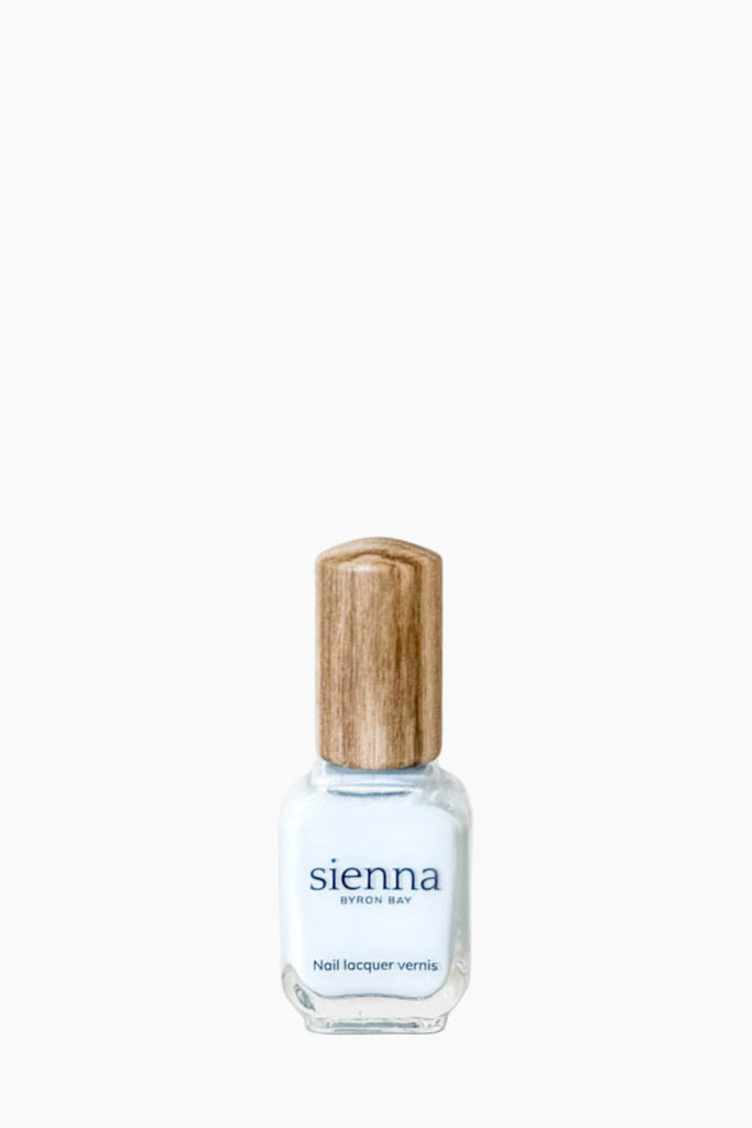 Nail polish bottle with wooden cap on a white background