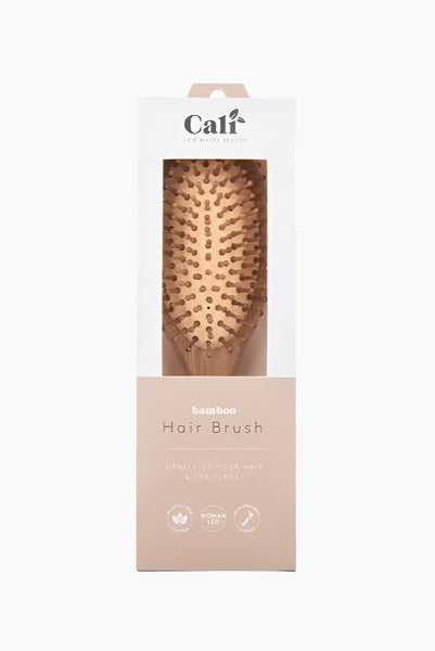 Hair brush in a caliwoods branded box on a white background
