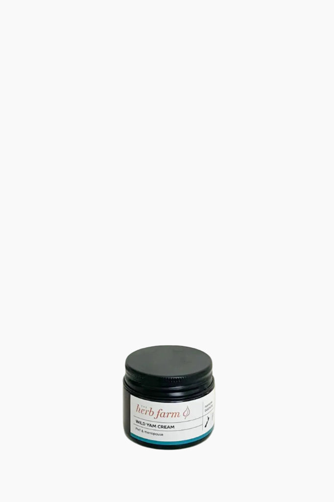 A jar of The Herb Farm Wild Yam Cream against a light background.