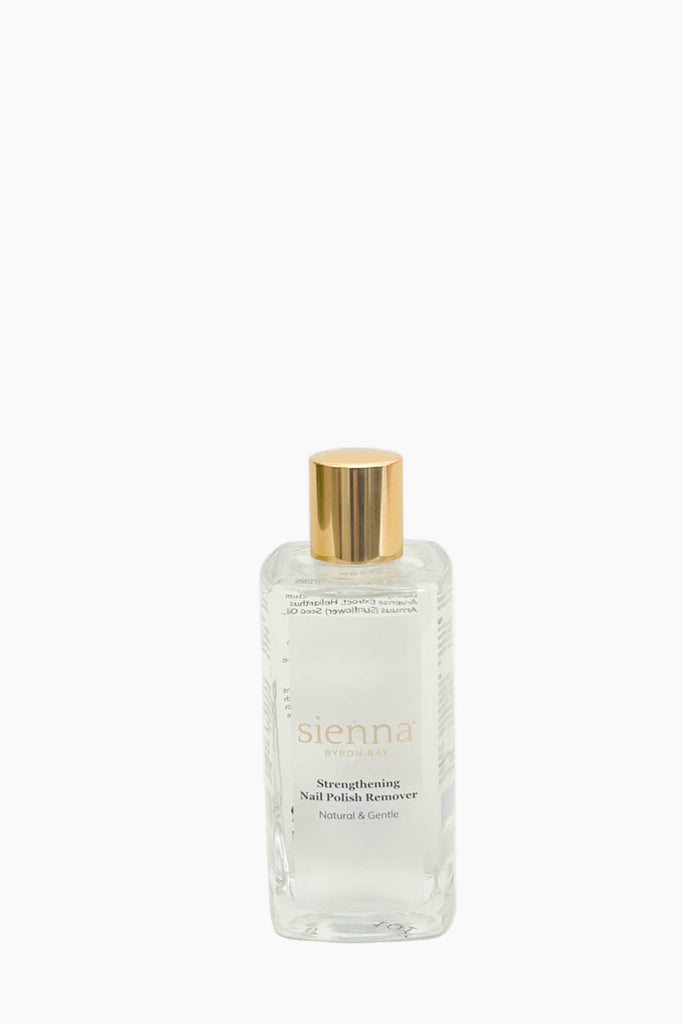 Clear bottle with gold cap labeled 'sienna' on a white background